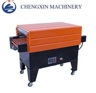 Shrinking packaging machine